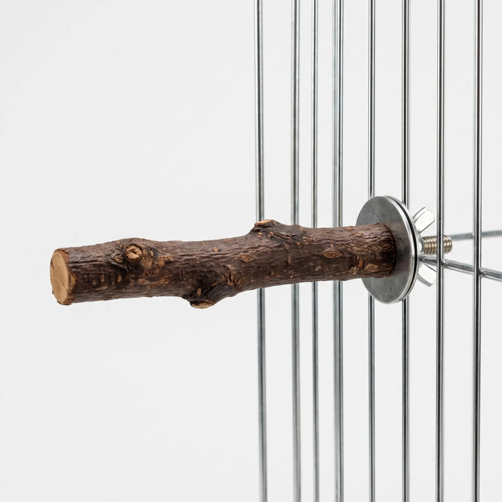 Wooden perch attached to the vertical bars of a wire cage with a metal washer and wing nut, side view. 4