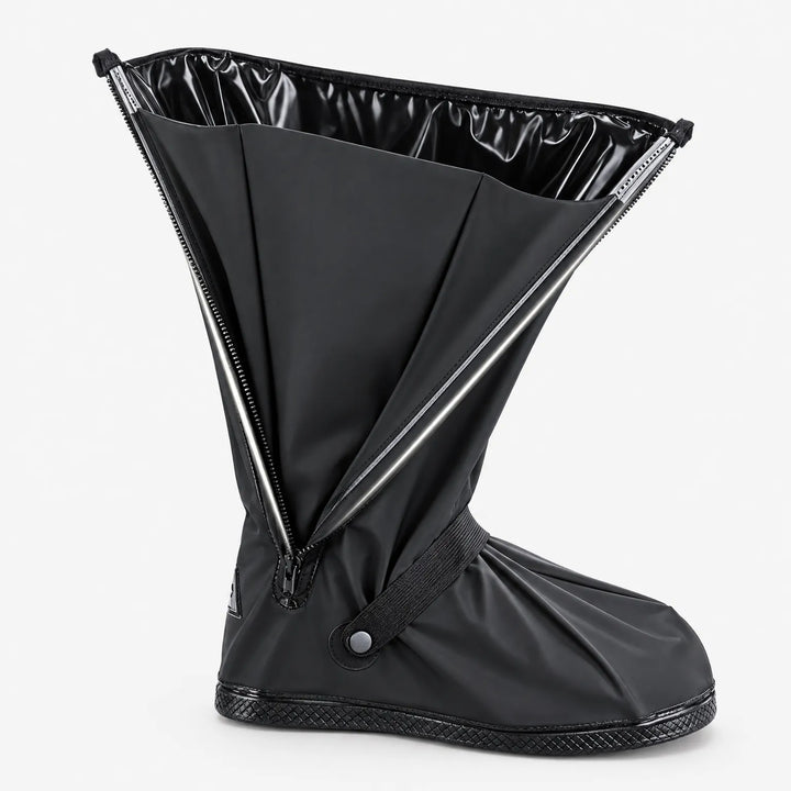 Black shoe cover standing alone with its side zipper fully open, showing the glossy black inner lining and ankle strap. 5