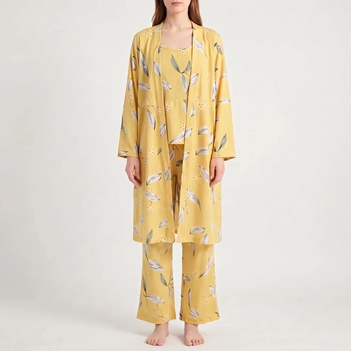 Front view of the set in a yellow colourway with white and green leaf print, worn by a model. 12