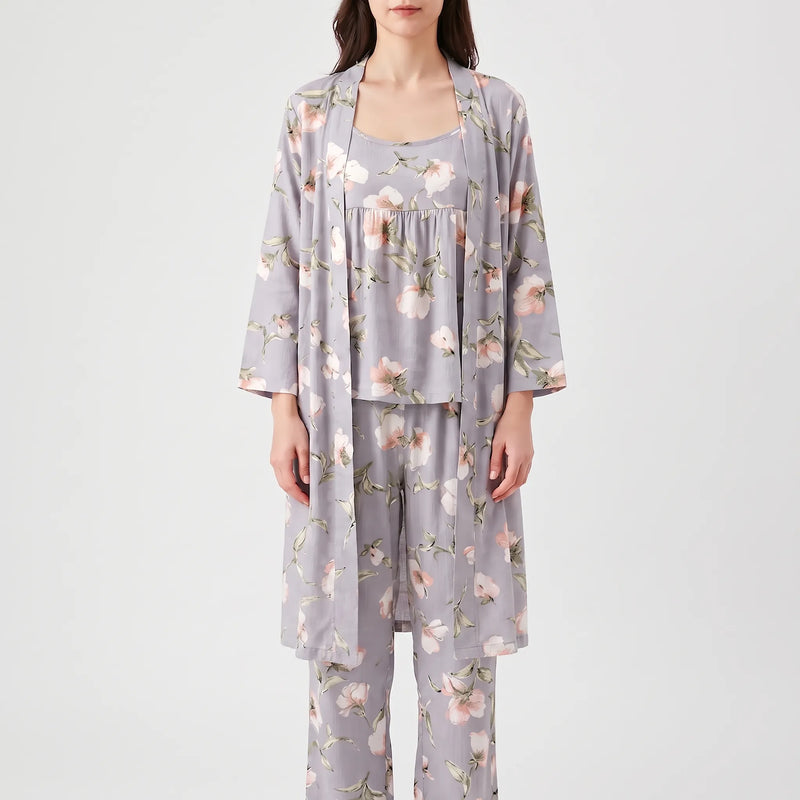 Front view of a model wearing the grey floral set: open long robe, gathered camisole top and wide trousers. 2