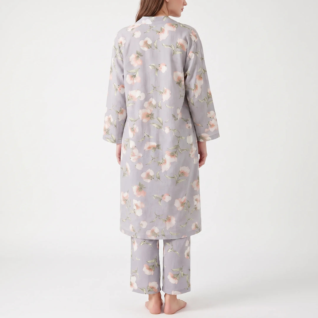 Back view of the grey floral robe worn with matching trousers, showing the scattered pink and white flower print. 3