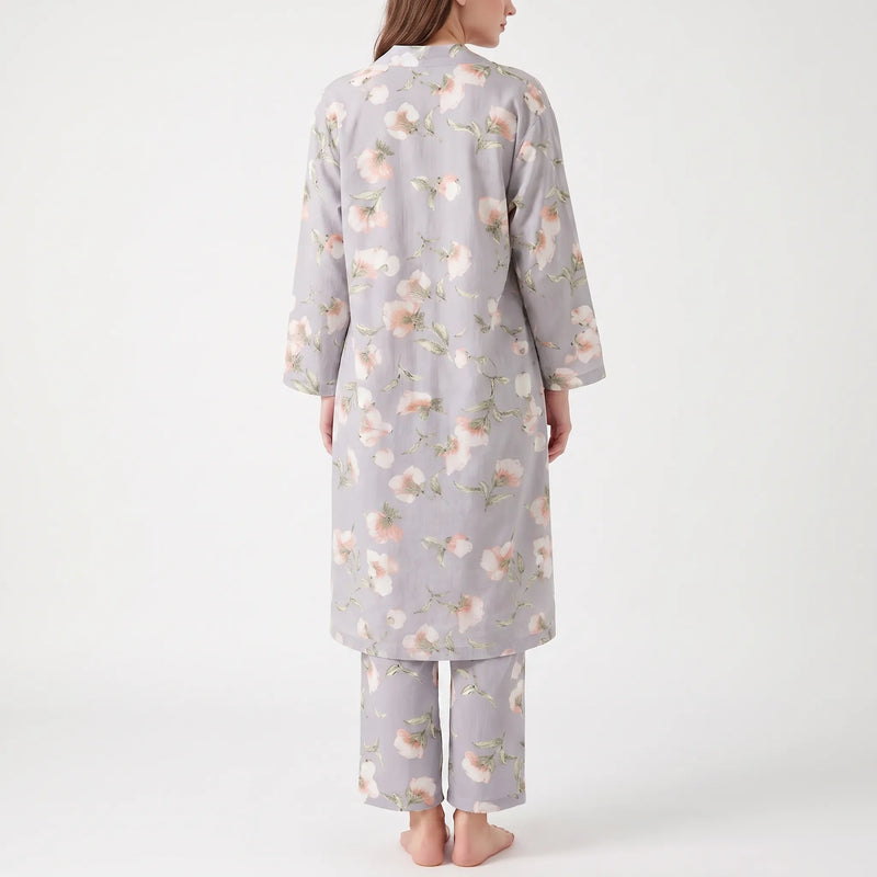 Back view of the grey floral robe worn with matching trousers, showing the scattered pink and white flower print. 3
