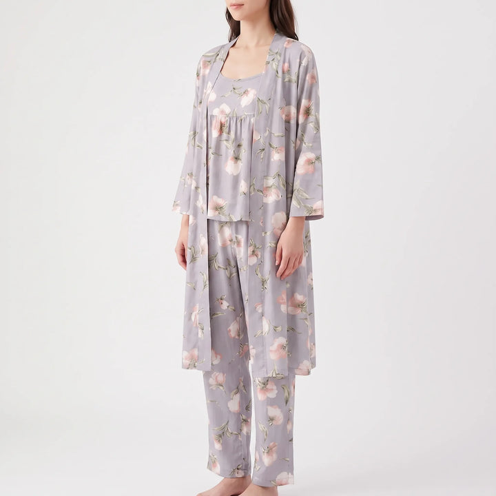 Angled front view of the grey floral robe, camisole top and trousers worn together by a standing model. 6