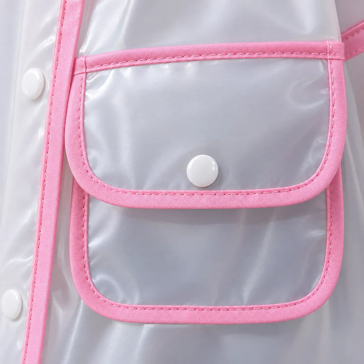 Close-up of a flap pocket on the clear raincoat, with pink fabric binding, stitched edges and a white snap button. 6