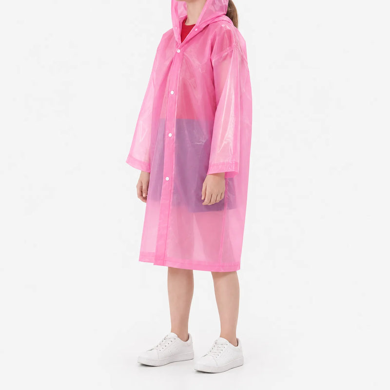 Side view of a girl in a translucent pink hooded raincoat with snap front and white sneakers, on a white background. 5
