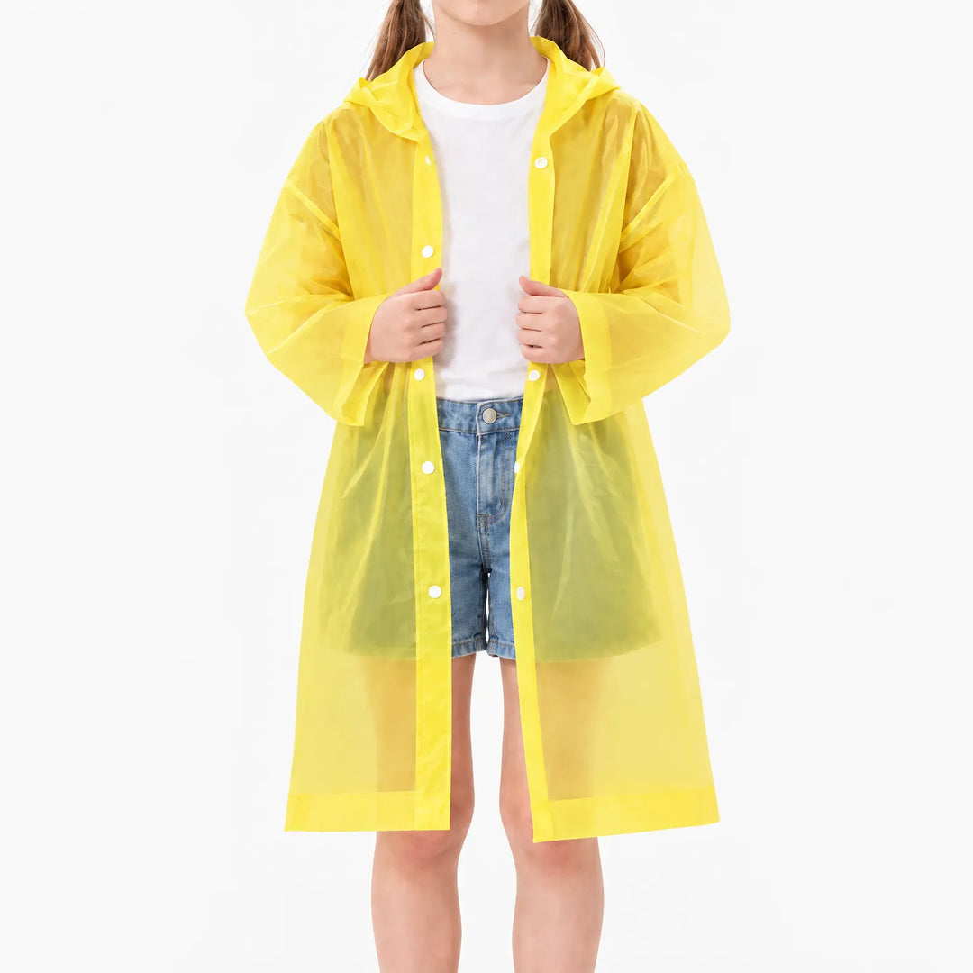 Girl in an unfastened translucent yellow hooded raincoat over a white t-shirt and denim shorts, showing the snap buttons. 9