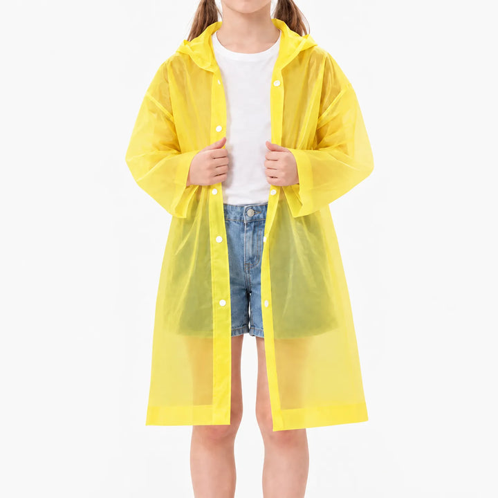 Girl in an unfastened translucent yellow hooded raincoat over a white t-shirt and denim shorts, showing the snap buttons. 9