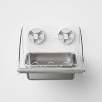 Straight-on front view of the clear acrylic bird feeder with a steel dish, textured perch and two suction cups. 1