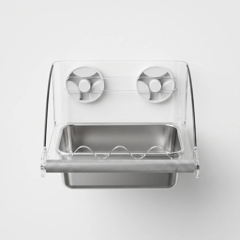 Straight-on front view of the clear acrylic bird feeder with a steel dish, textured perch and two suction cups. 1