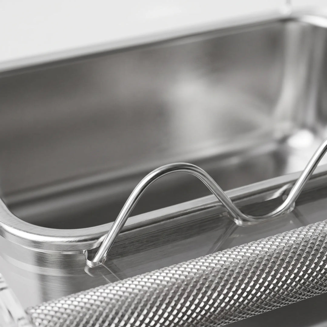 Close-up of the stainless steel dish, its wavy clear divider and the knurled metal perch. 3