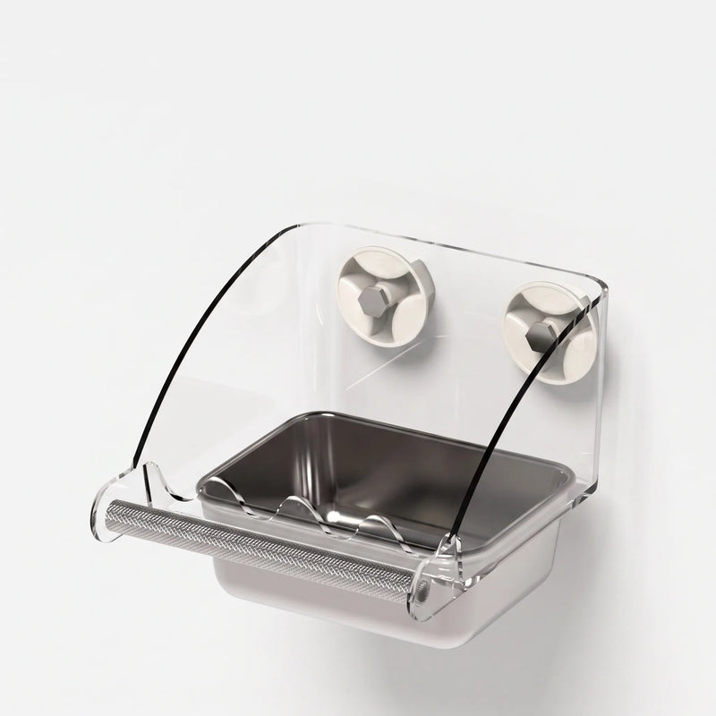 Three-quarter view of the empty feeder with two suction cups, curved clear shield, steel dish and textured perch. 5