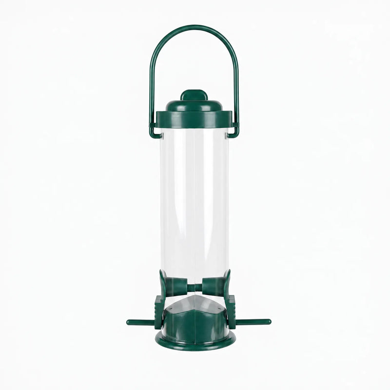 Empty clear tube bird feeder with dark green lid, arched carry handle, two feeding ports and small perches, shown against white. 1
