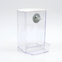 Empty clear feeder with a white lid, a metal washer and bolt for fixing to the cage, and a front tray. 4