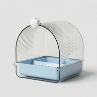 Bath with a pale blue base and white knob, shown on a plain light background without a cage. 5