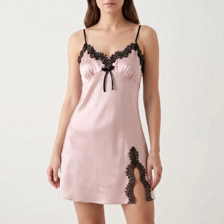 Model wearing a pale pink satin version with black lace neckline, black ribbon bow, and a black lace-trimmed hem slit. 14