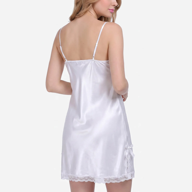Back view of the white satin nightdress on a model, showing adjustable thin straps and a bow with lace at the hem side. 3