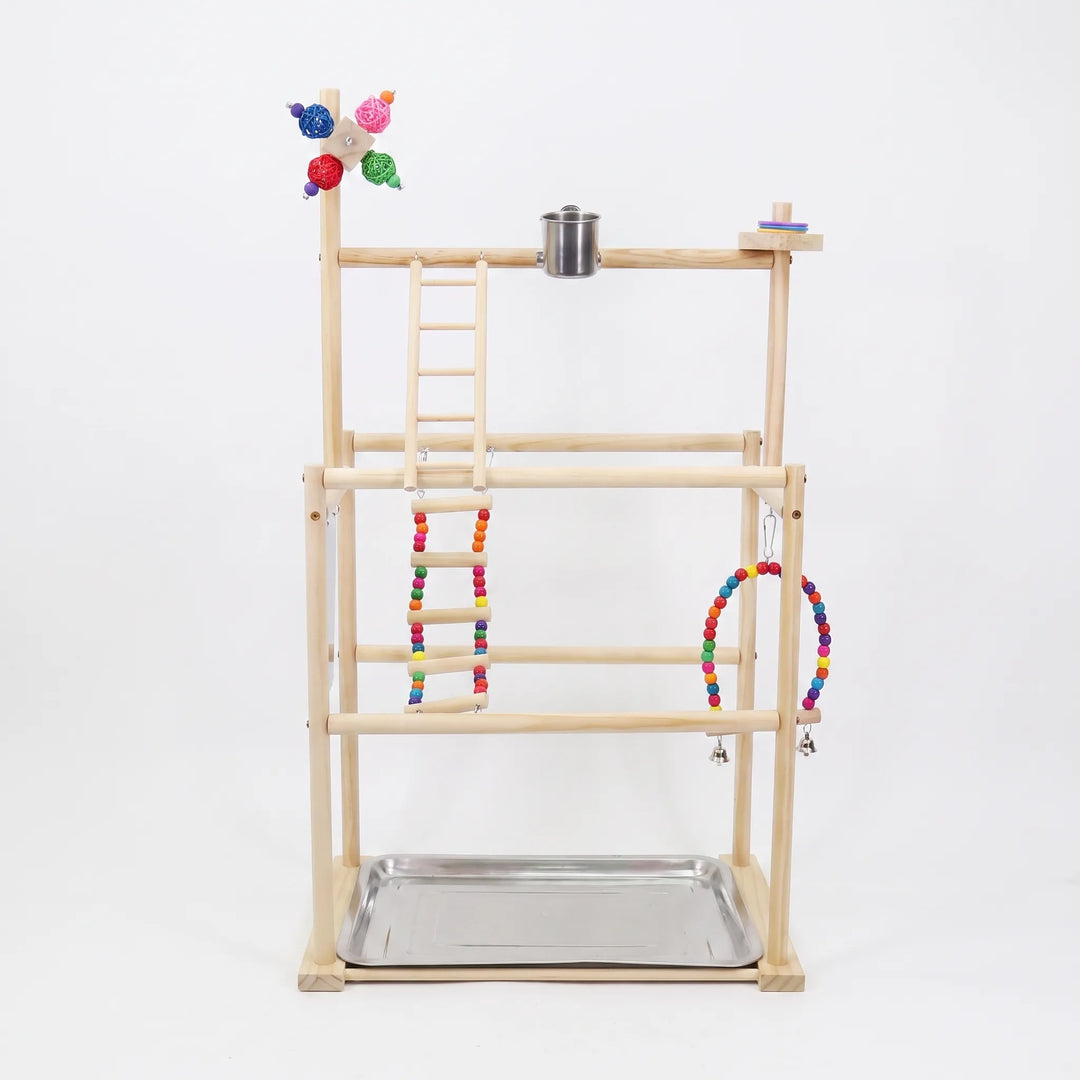 Front view of a multi-tier wooden bird playground on a plain white background, with beaded ladder, swing, steel cup and tray. 1