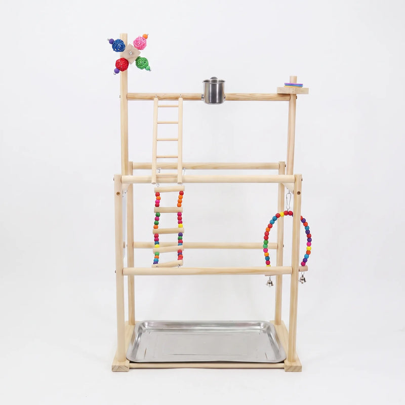 Front view of a multi-tier wooden bird playground on a plain white background, with beaded ladder, swing, steel cup and tray. 1