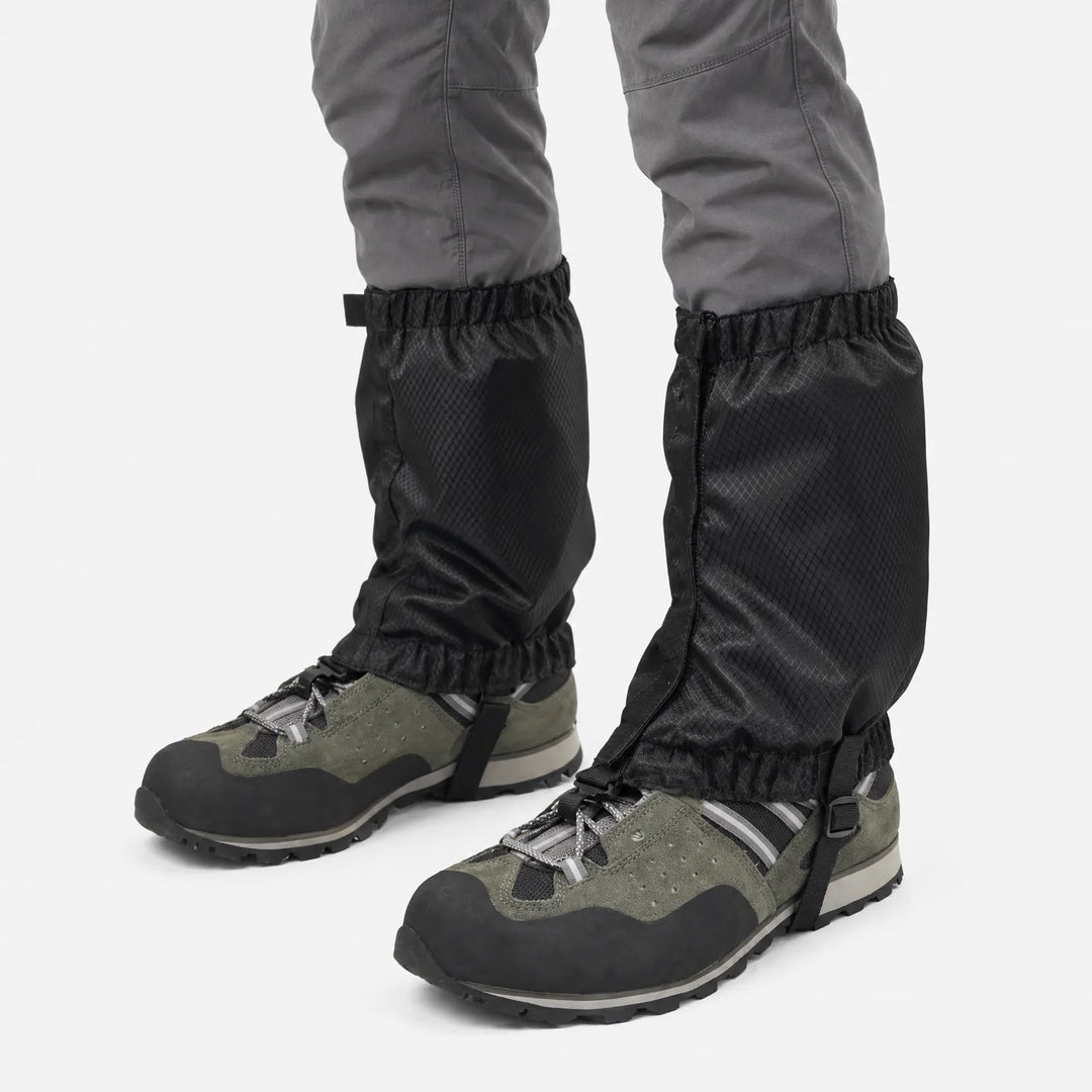 Black ripstop gaiters with zip closure and elastic hems, worn over green hiking shoes against a white background. 5
