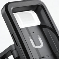 Close-up of the mount's black case, showing the clear top window, magnet symbol on the back plate and the hinged arm. 3