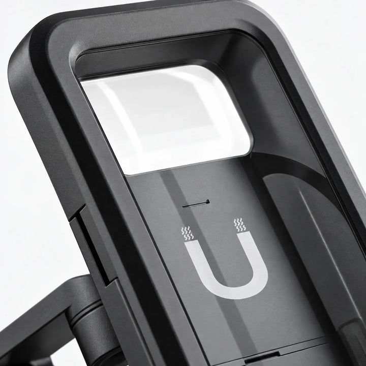 Close-up of the mount's black case, showing the clear top window, magnet symbol on the back plate and the hinged arm. 3