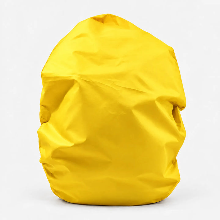 Bright yellow rucksack cover pulled over a bag, shown from the front against a plain white background. 12