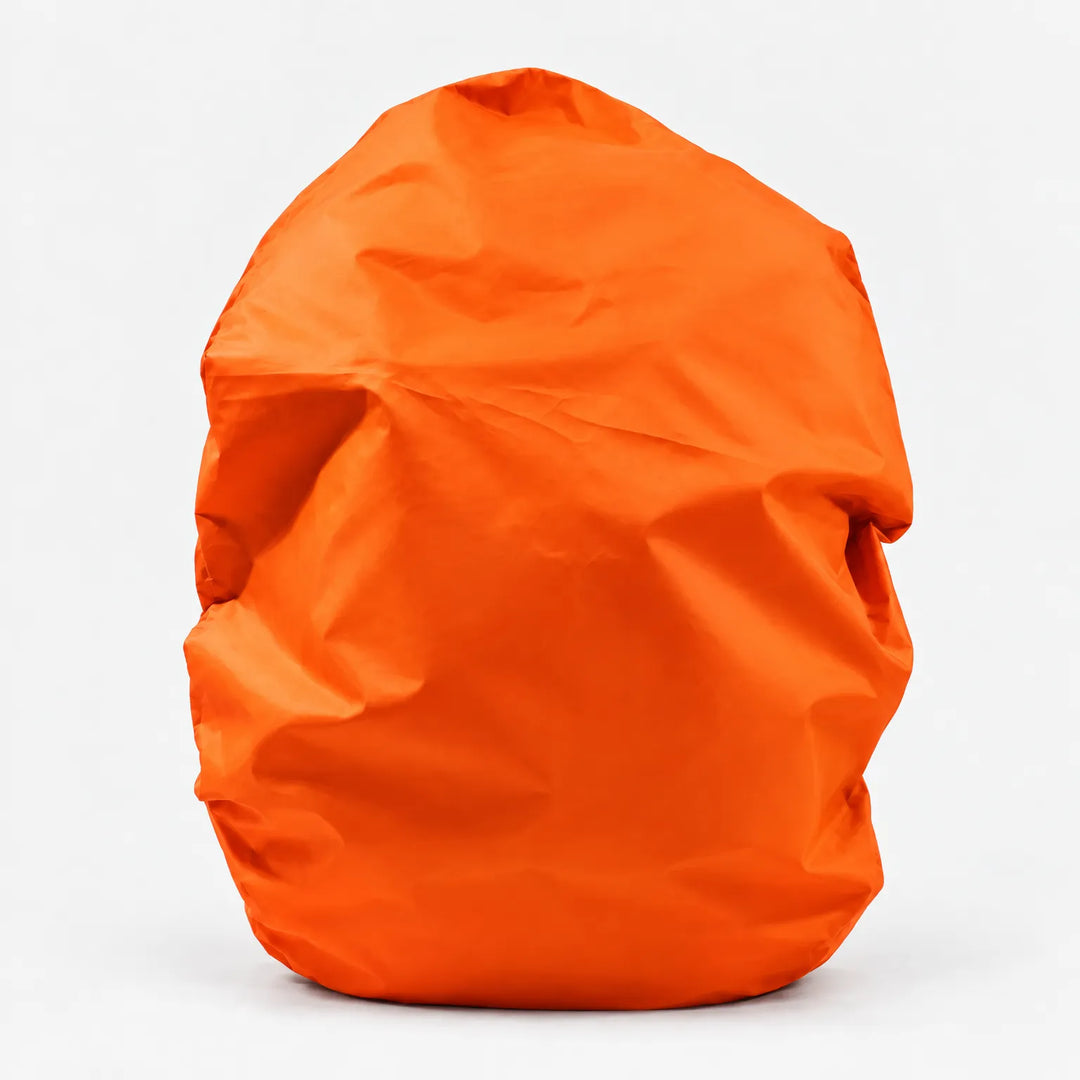 Vivid orange rucksack cover pulled over a bag, shown from the front against a plain white background. 9