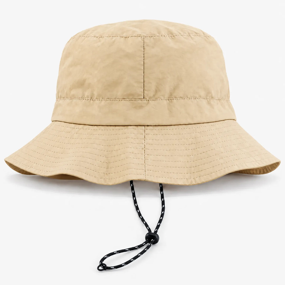 Back view of a beige bucket hat showing the rear seam, stitched brim and drawcord with toggle. 7