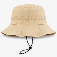 Back view of a beige bucket hat showing the rear seam, stitched brim and drawcord with toggle. 7