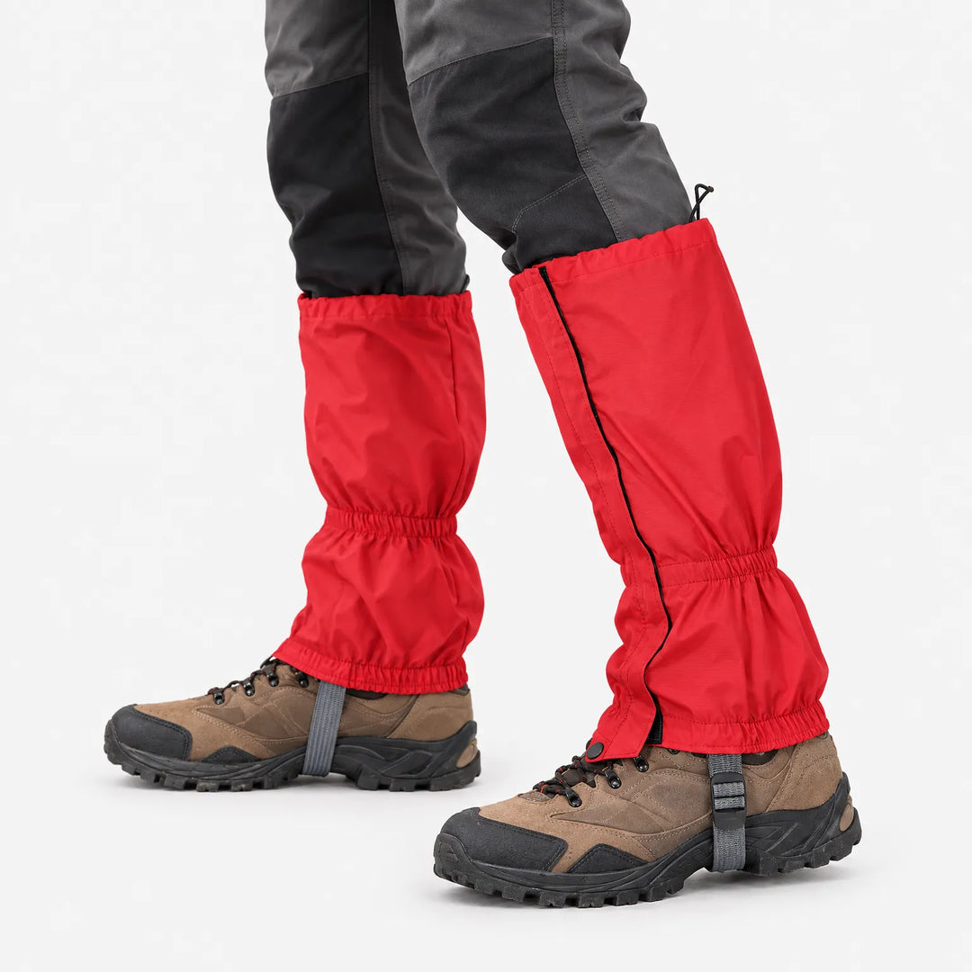 Close view of red gaiters worn over brown hiking boots, showing the side zip, elasticated cuffs, drawcord top and boot strap. 5