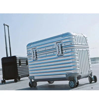 Silver case with blue light reflections in the foreground and a black case with raised handle behind 6