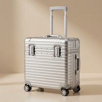 Silver ribbed case with extended handle, angled to show the front locks and side carry handle 12