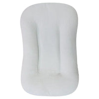 Empty pale grey lounger seen from above, showing the crinkled cover and central channel 11