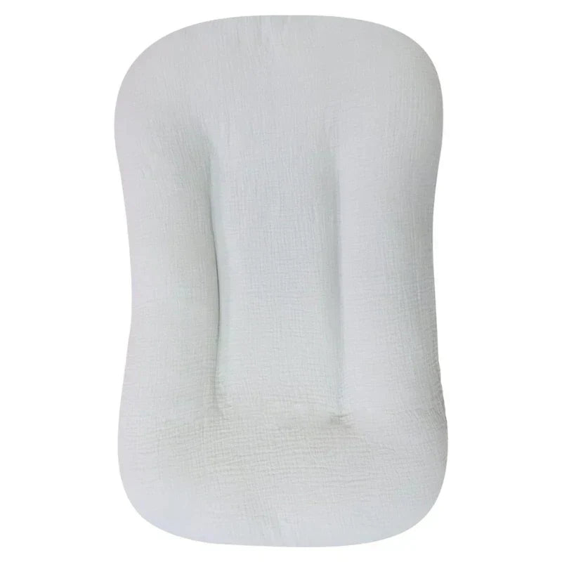 Empty pale grey crinkled cotton nest photographed flat from above on a white background 11