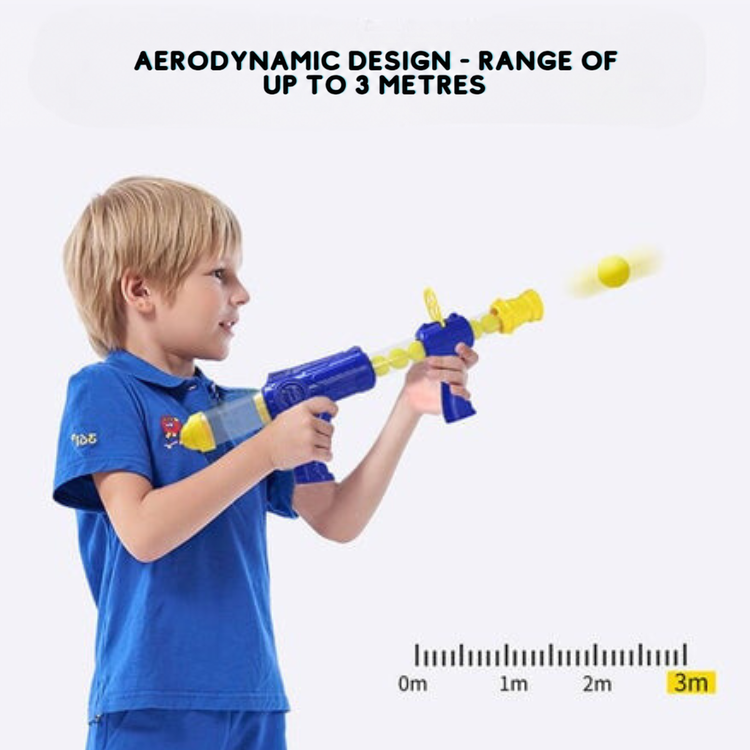 Boy in a blue polo shirt fires a foam ball, with a scale showing a range of three metres 9