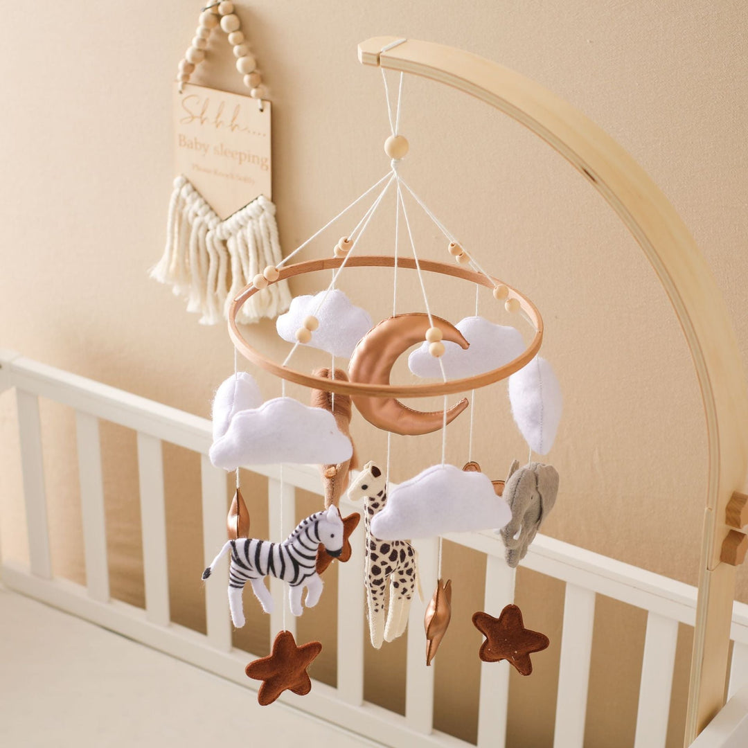 Mobile hanger with felt safari animals to stimulate babies' sensory perception.