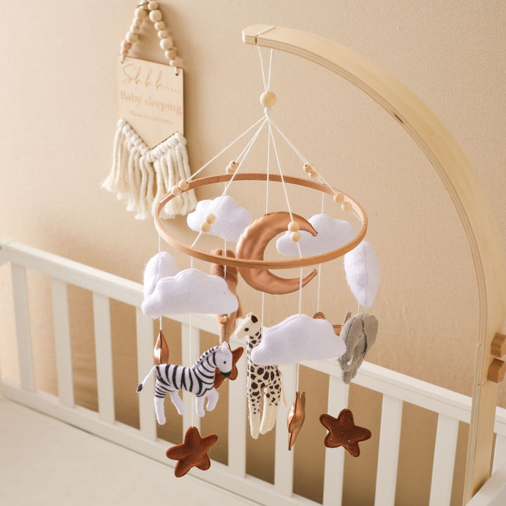 Mobile hanger with felt safari animals to stimulate babies' sensory perception.