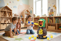Three children kneel on a colourful rug in a playroom while a girl aims at the duck target 1