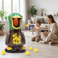 Boy aims a blue and yellow foam-ball blaster at the green duck target while his smiling mother watches 1