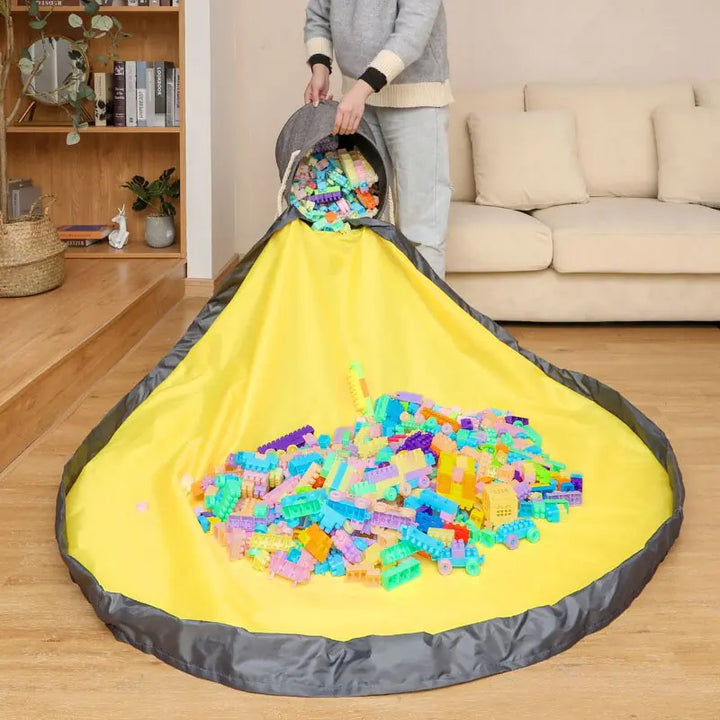 Large foldable toy tidy-up mat with basket function for the children's room.