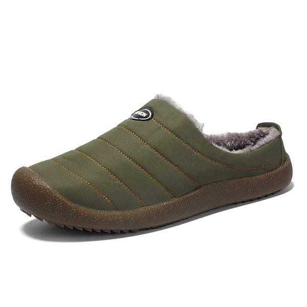 Single olive green quilted slipper on white, showing fleece lining and brown sole 14