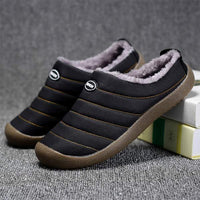 Pair of black quilted slippers with grey fleece lining, one resting on books 8