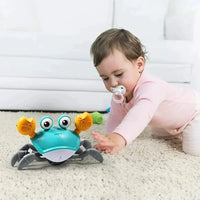 Interactive crawling toy with movement and music - Scratchy Crab