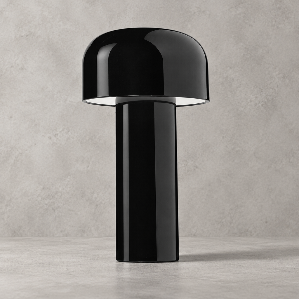 Glossy black lamp with domed shade and white underside glow, against a grey wall 33
