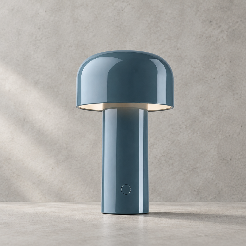 Glossy slate-blue lamp with domed shade, touch button on stem, against a grey wall 30