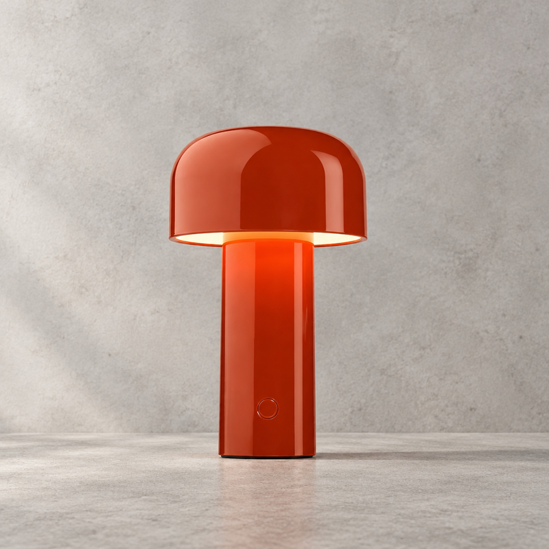 Glossy red-orange lamp lit against a grey stone-effect wall, touch button visible on the stem 29
