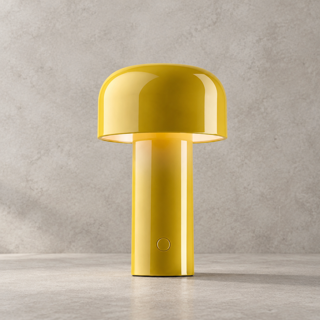 Glossy yellow lamp lit on a stone-effect surface, with touch button on the stem 31
