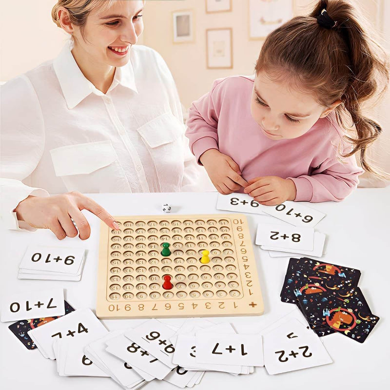 Learning game: wooden board for the 1–10 times tables with cards and dice