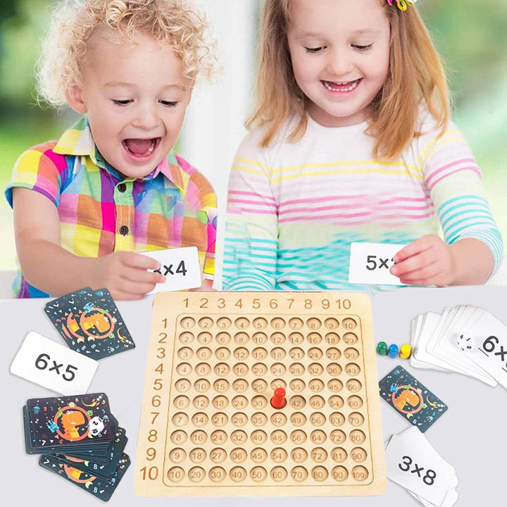 Learning game: wooden board for the 1–10 times tables with cards and dice