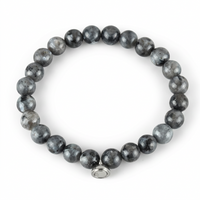 Studio shot of the glossy grey speckled bead bracelet with a silver magnetic charm on white 7